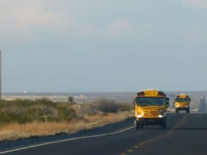 School busses travel NM-11 weekdays during the school year bringing students from Puerto Palomas to attend classes in Deming, NM.
